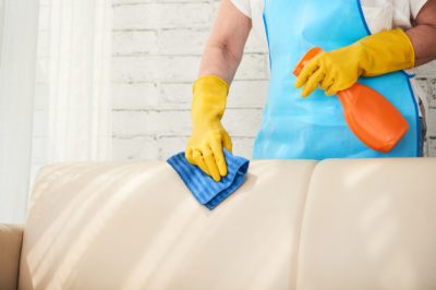 mid-section-unrecognizable-housekeeper-wiping-leather-sofa-with-leather-polish-spray_1098-19042.jpg